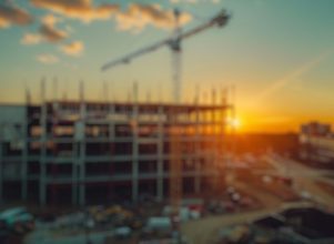 A crane in the background of a building under construction